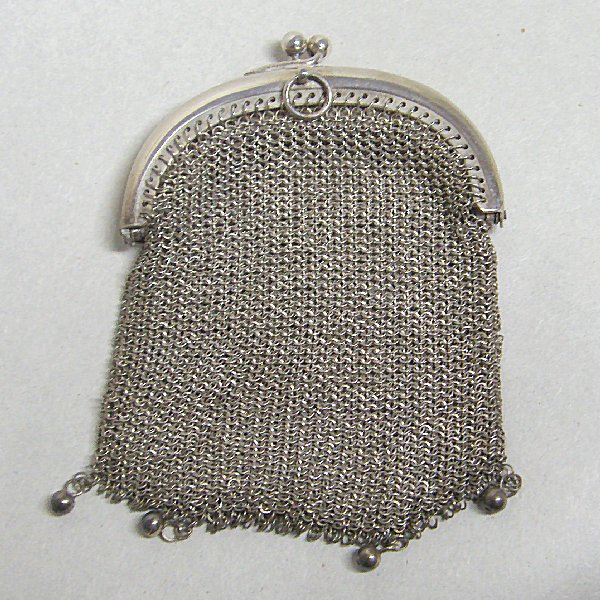 (a1031)Silver double-fabric wallet.