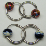 (e1337)Aros de plata con pequeas bolitas de colores esmaltadas.