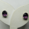 (e1348)Aros de plata con piedra de color oval.