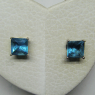 (e1349)Aros de plata con piedra de color central.