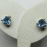 (e1378)Aros de plata con piedra celeste.