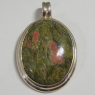 (p1283)Silver pendant with central oval stone.
