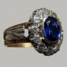 (r1306)Anillo antiguo de plata con piedra central azul.