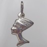(p1593)Silver pendant in the shape of a bust of Nefertiti.